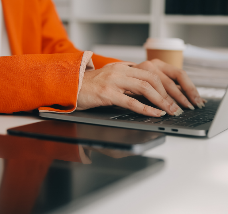 close-up-business-woman-using-calculator-laptop-math-finance-wooden-desk-tax-accounting-statistics-analytical-research-concept
